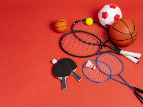 Sport equipment flat lay. Variety of rackets and balls Sport equipment flat lay. Variety of rackets and balls